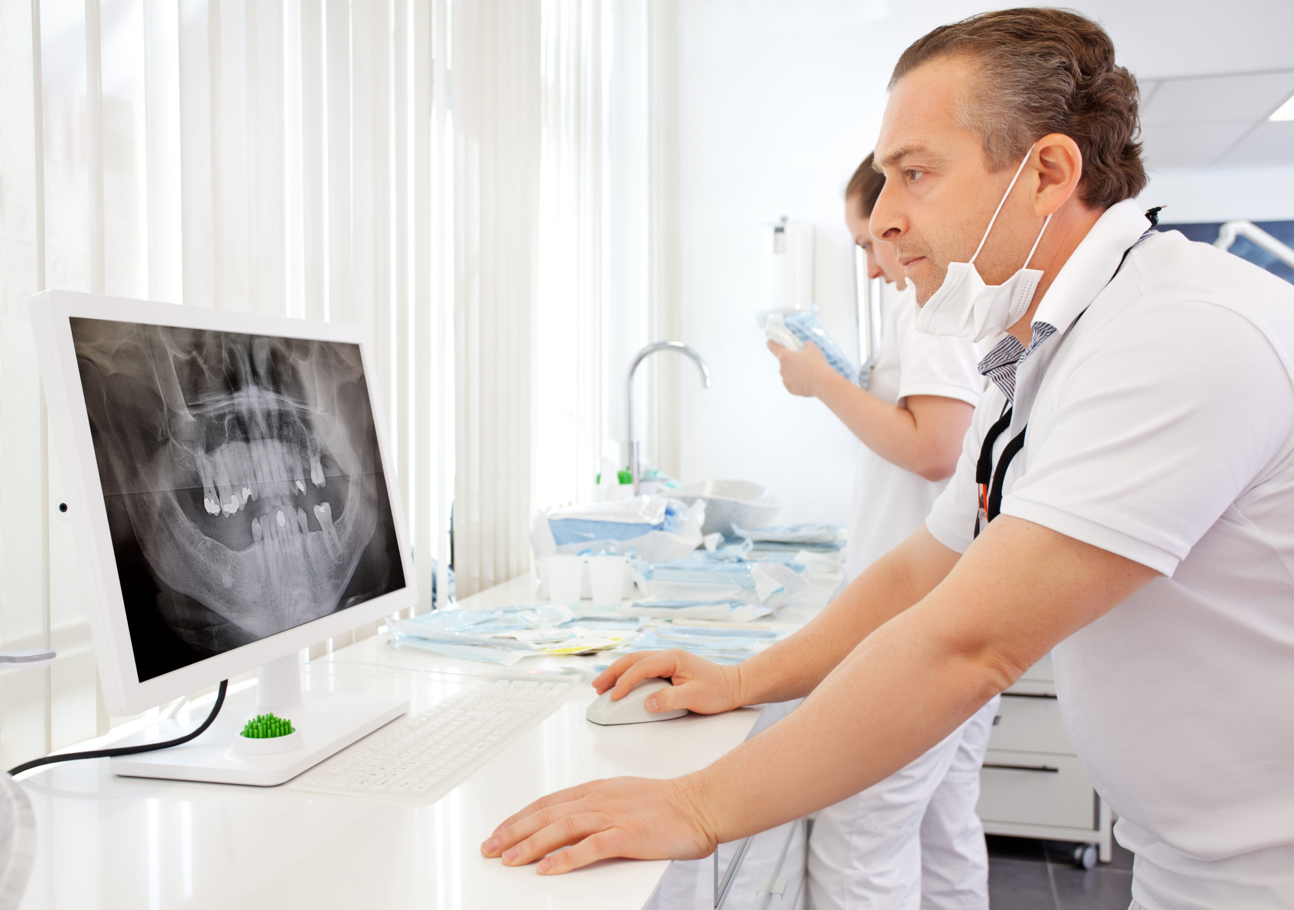 dentist looking at x-ray image | EON Clinics